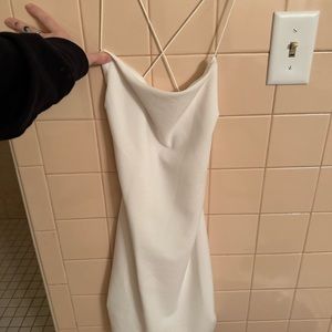 Beautiful white, backless mini dress.